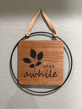 Stay Awhile Rustic Wood Wall Sign with Black Leaf Accent
